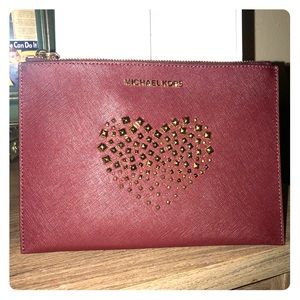 Michael Kors Maroon wristlet w/stud heart detail